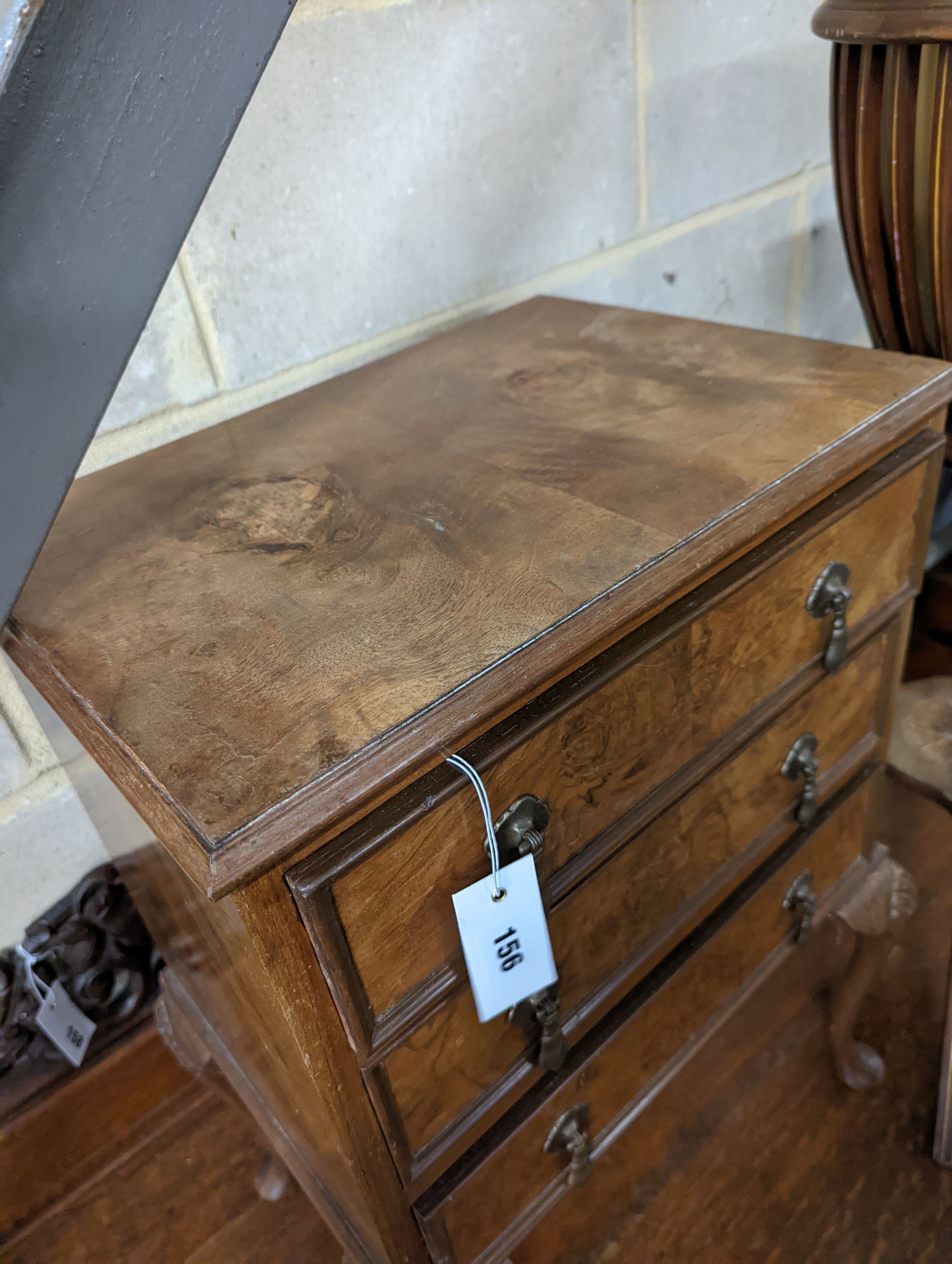 A small Queen Anne revival walnut three drawer chest, width 49cm, depth 35cm, height 69cm